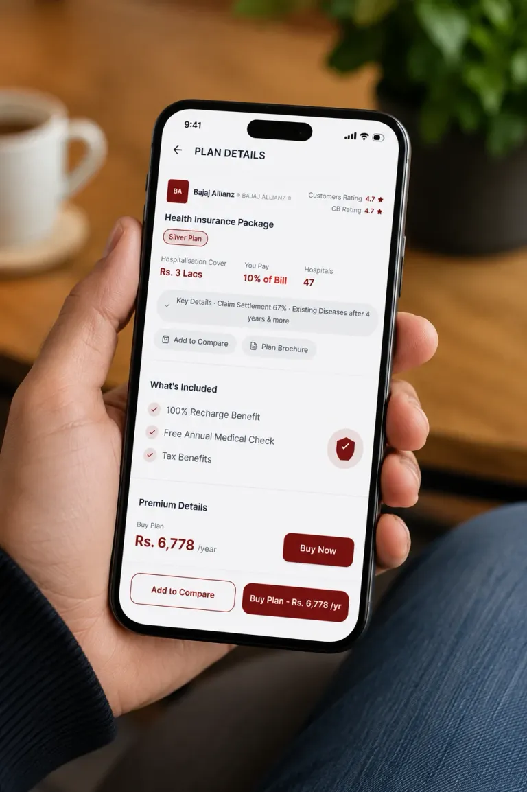 A hand holding a phone that shows GroupBima’s Plan Details screen: ratings, hospitalisation cover, what is included, premium details and Add to Compare and Buy Plan buttons