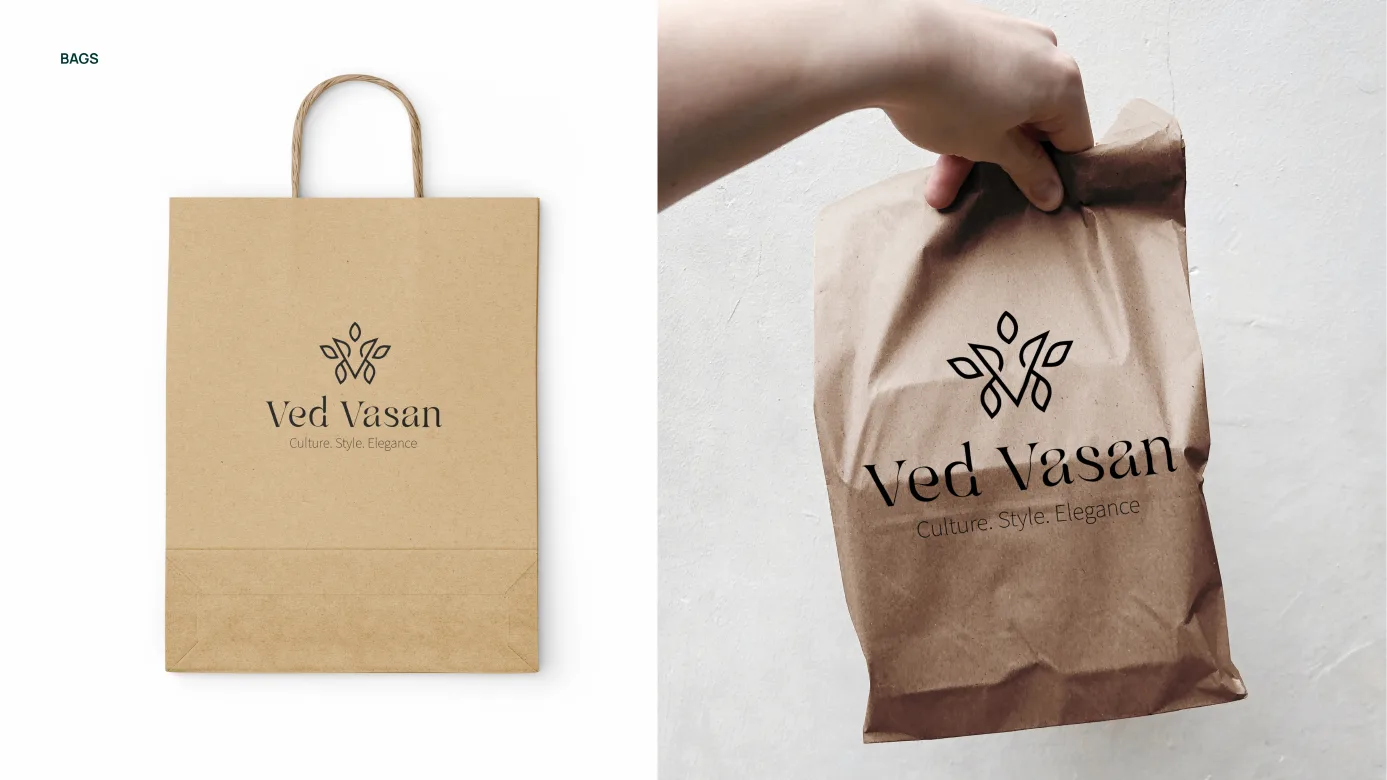 Paper shopping bags printed with the Ved Vasan logo